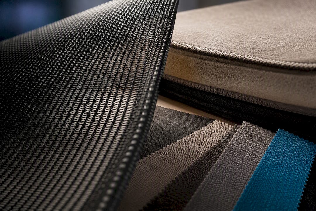 Mesh and upholstered seating material close-up