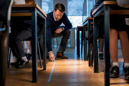 Classroom seating being checked for fit