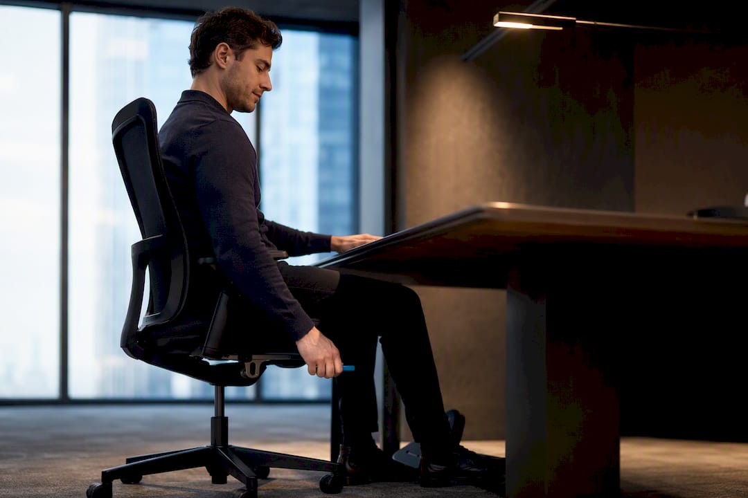 Worker checking ergonomic elbow height setup